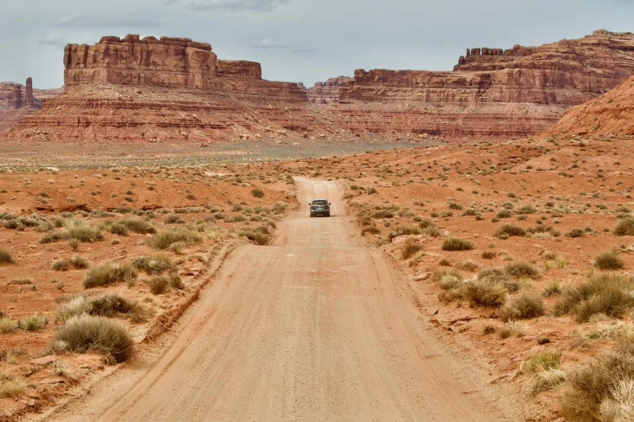 Car driving on a desert road