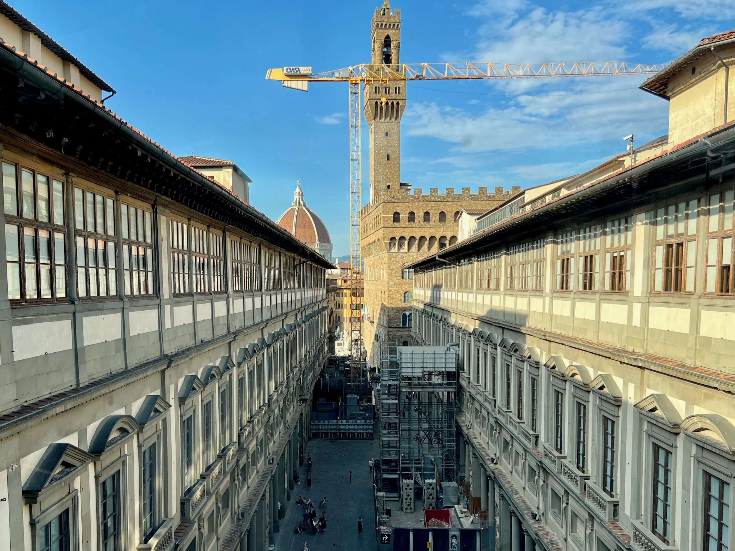 looking out a window at the old buildings of florence