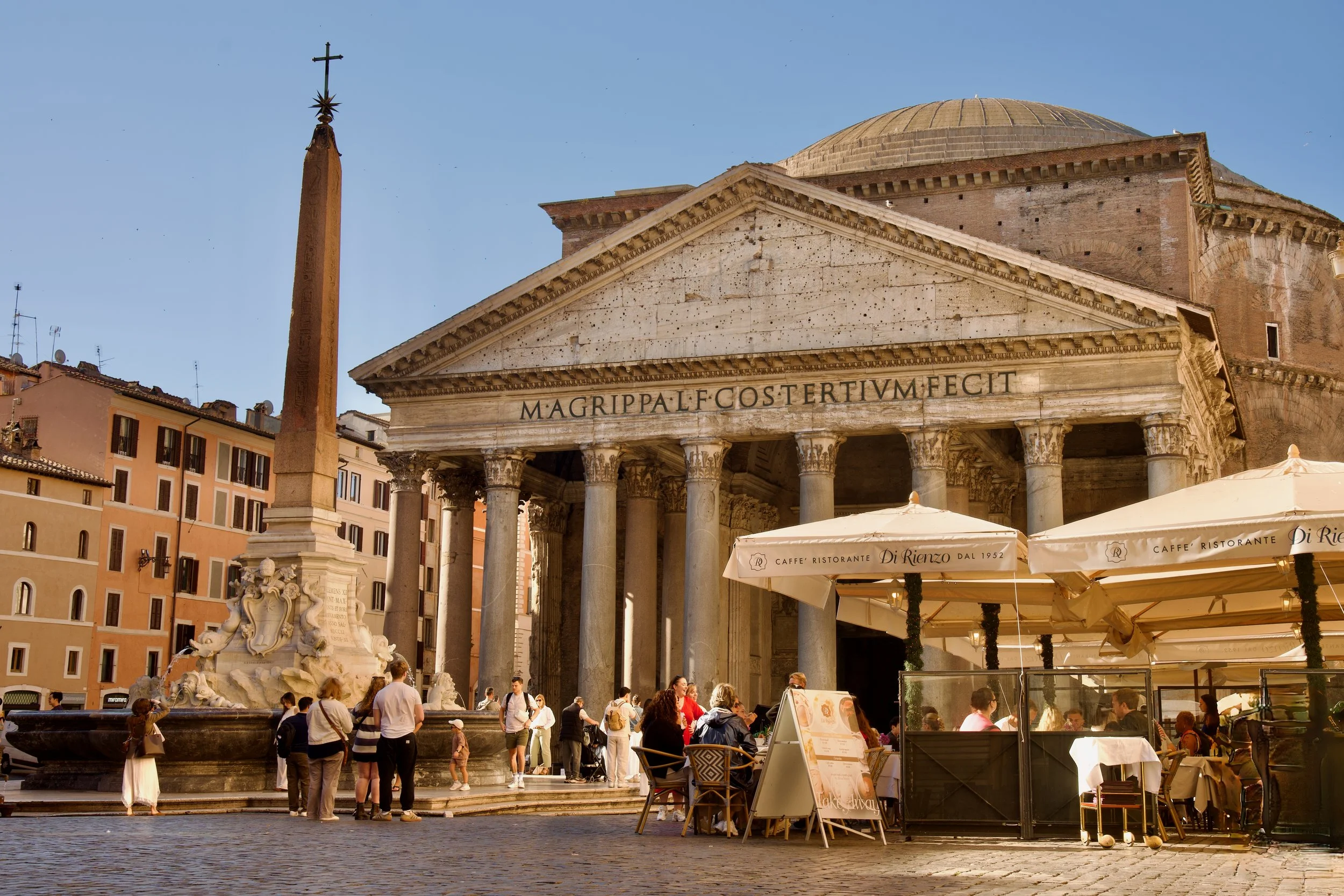 Roman piazza with cafes and historic buildings