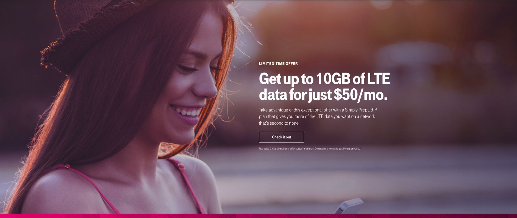 A woman looks down at her phone. Get up to 10 gigabytes of LTE data for just fifty dollars per month