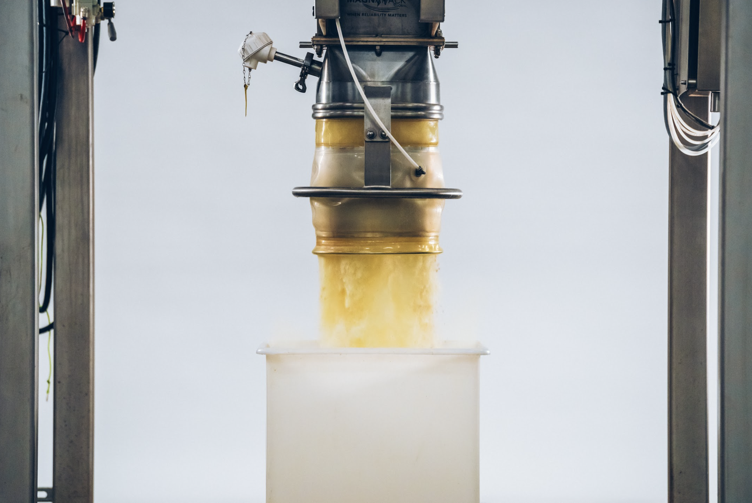 Free-flowing food powder moving consistently through industrial processing equipment