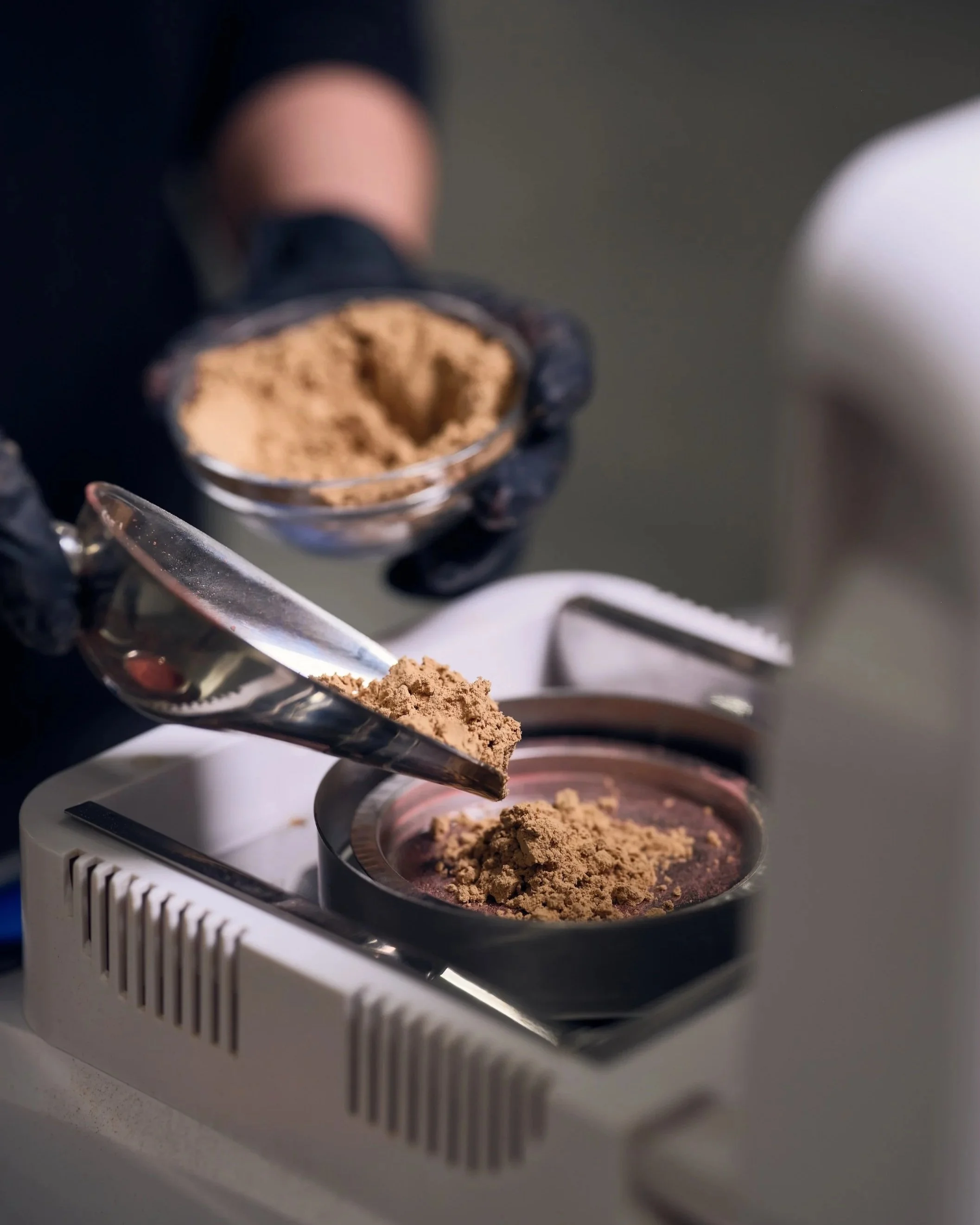 Lab equipment measuring moisture content of feedstock for industrial drying compatibility