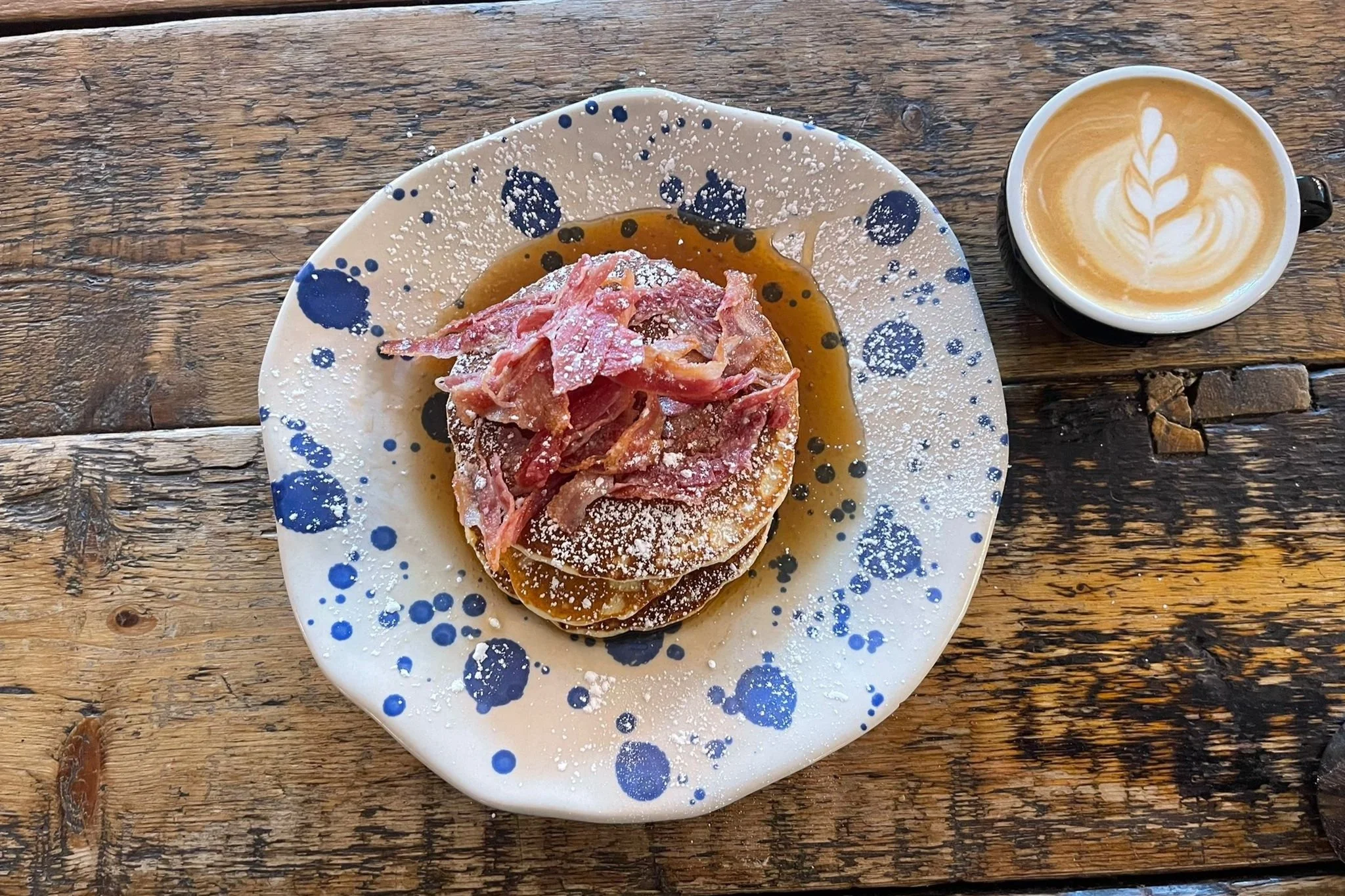 Bacon pancakes with flat white