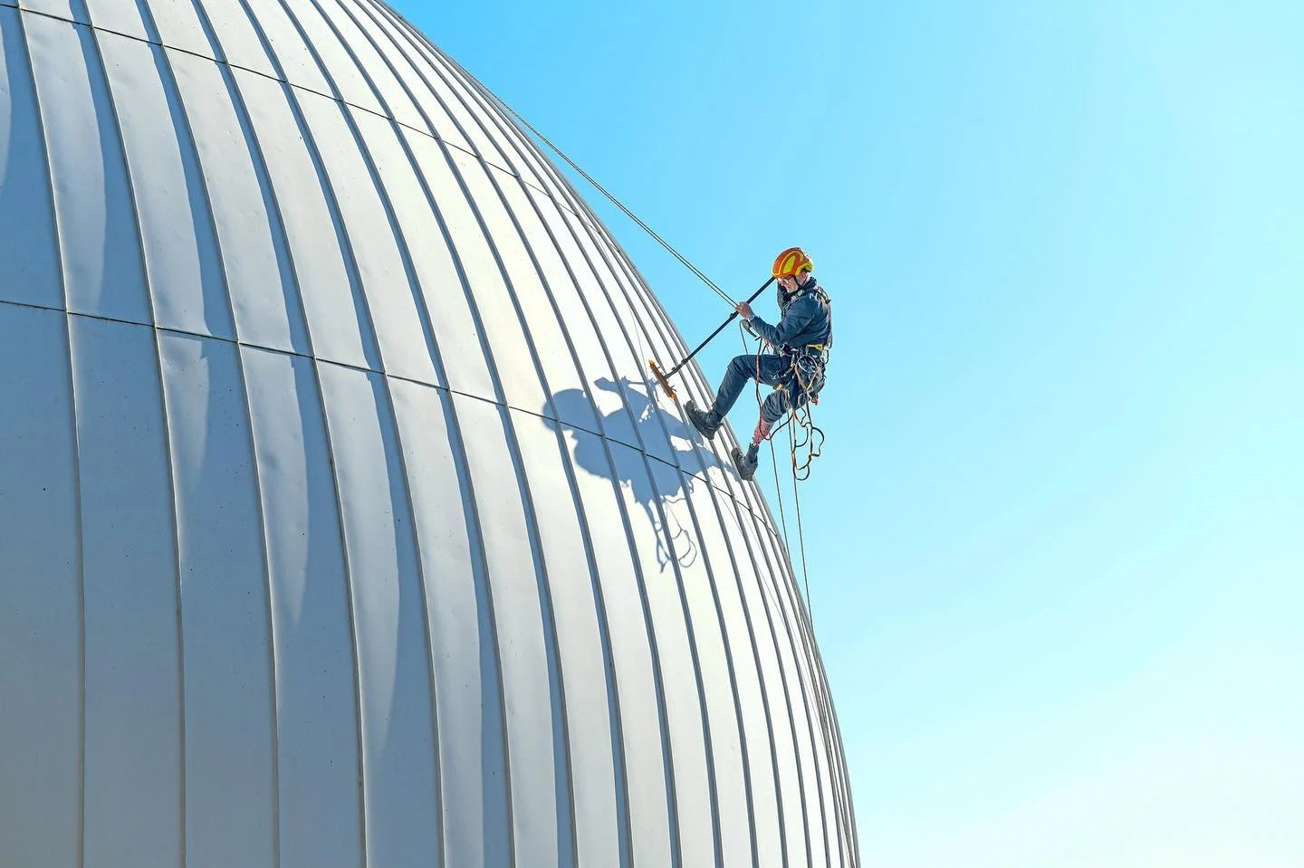 Abseiler Kev Wilkinson, 56, from The Abseilers, tackles a week-long clean of the UK’s largest standalone planetarium in Winchester, Hampshire. The towering 64ft (19.5m) dome, with a 62m circumference and 168-seat capacity, requires cleaning onc