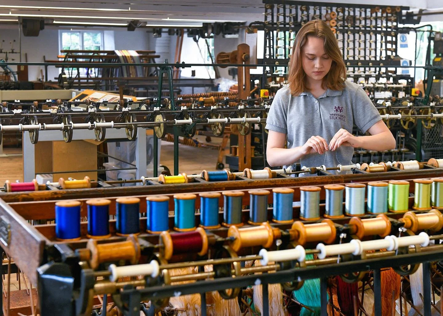 Graduate Chloe Mortiboys, 22, is pictured working on a loom at the oldest silk mill in the UK still in its original building, producing silk since 1817. Chloe took up a 6-week placement at Whitchurch Silk Mill, Winchester, Hants, to refine her techn