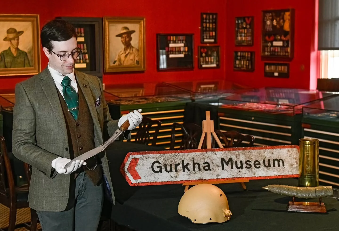 Assistant Curator Doug Henderson admires an original 105mm Shell case featuring Queen’s Gurkha signal inscriptions.β¨β¨These pieces were selected to be a part of a 50th anniversary exhibition celebrating the history and evolution of the Gurkha&rs
