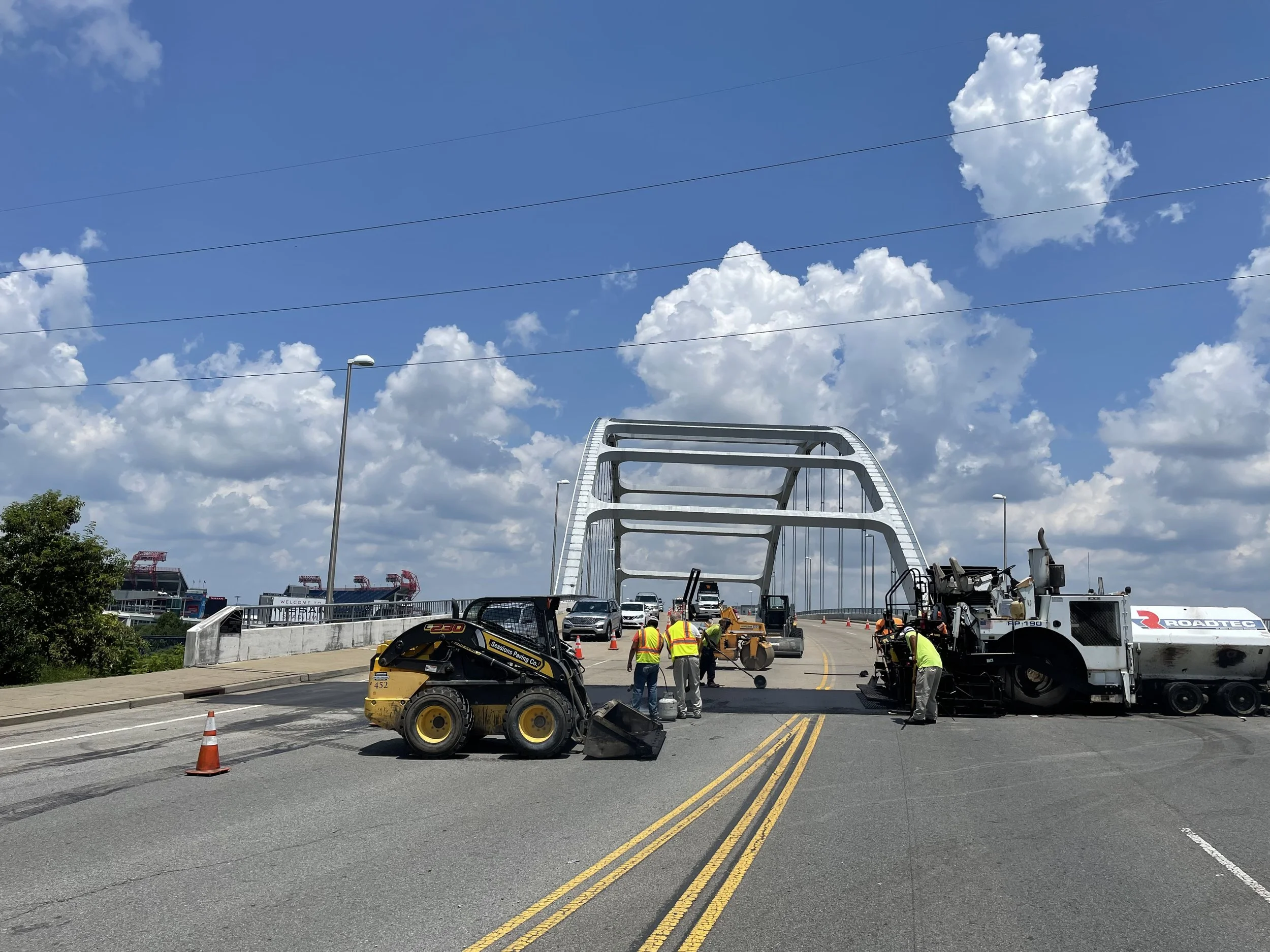 An image of Sessions Paving Company repairing the asphalt bridge transitions for the Music City Grand Prix in downtown Nashville Tennessee in Davidson County TN on the Shelby Ave / Korean Veterans Blvd Bridge