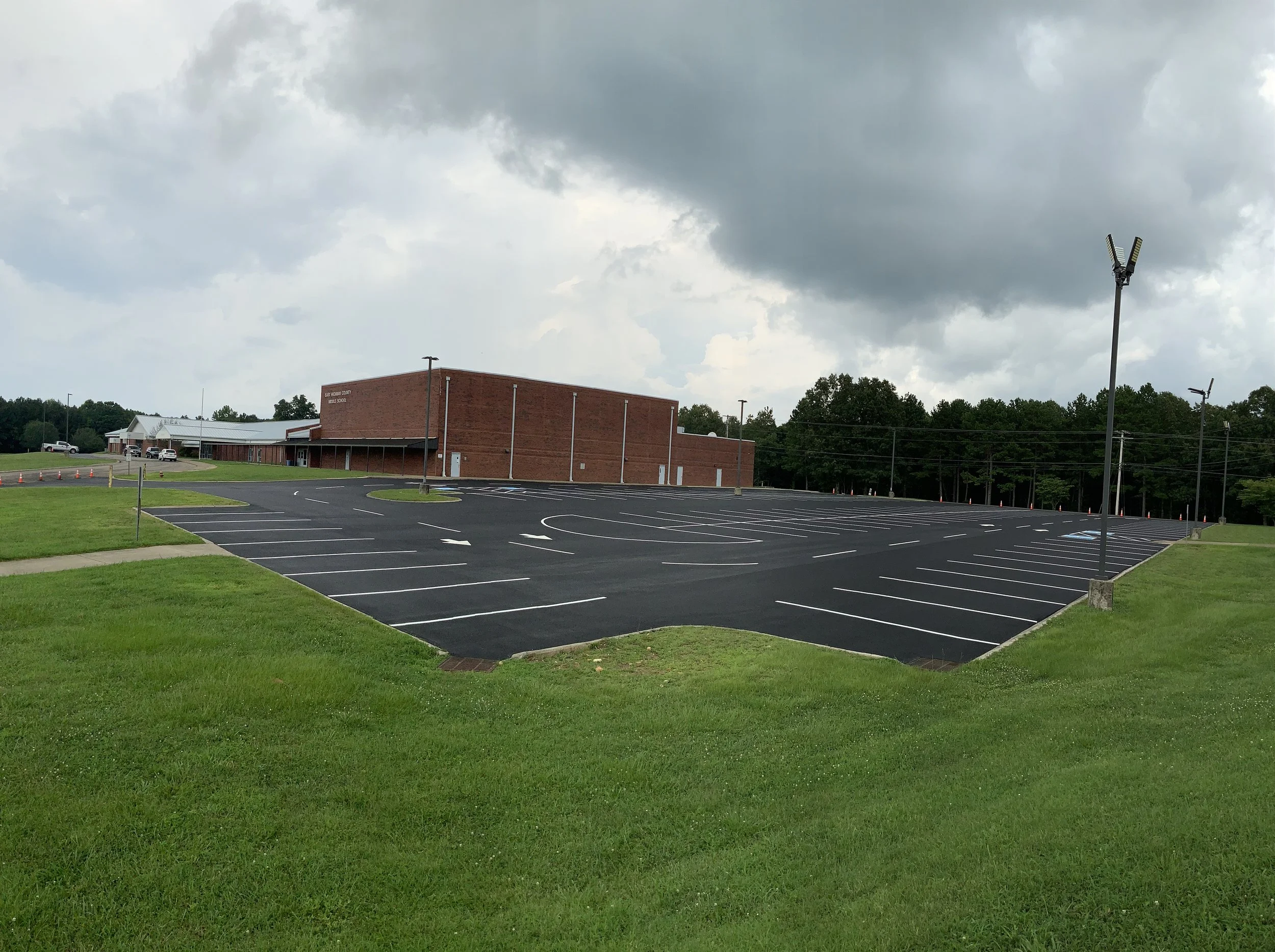 A parking lot paved by Sessions Paving Company and Striped by Sessions Sealing and Maintenace Company in Hickman County Tennessee in Lyles, TN