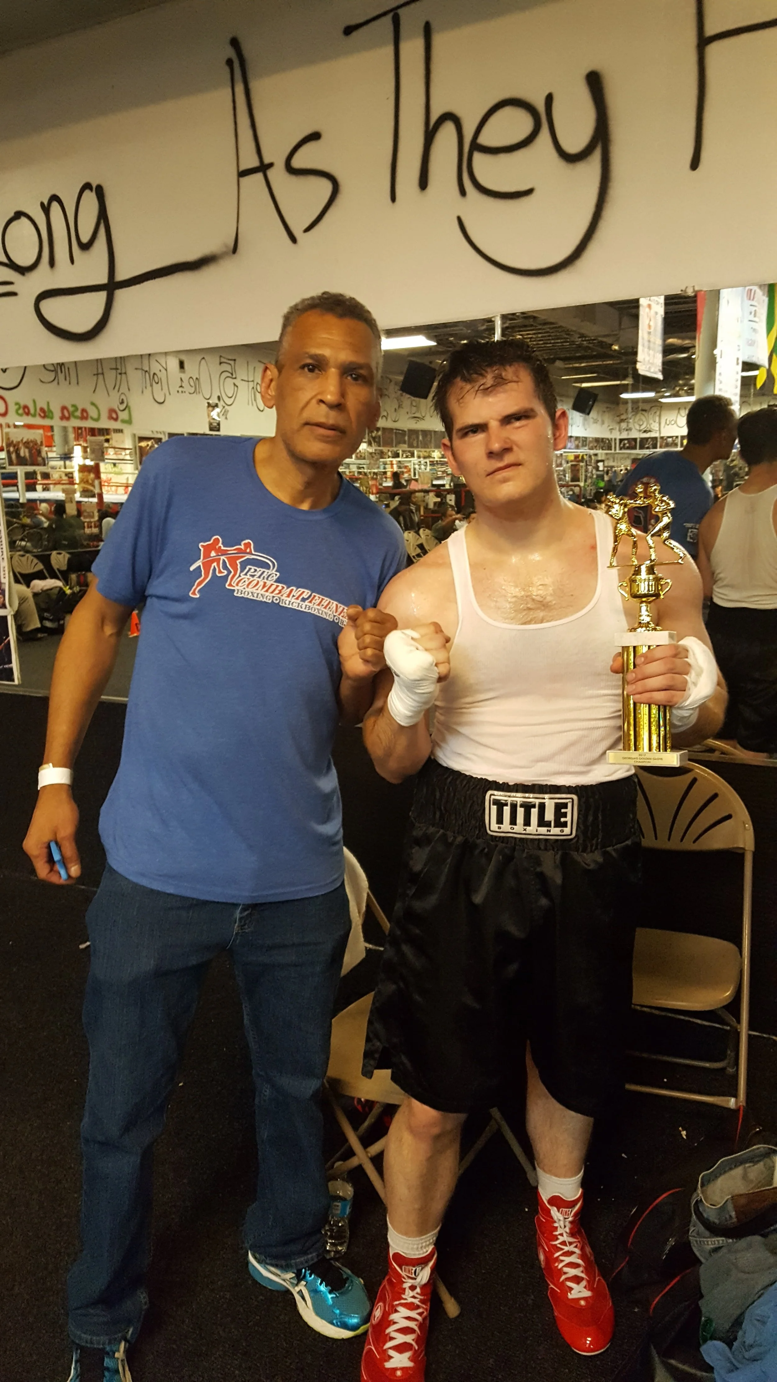 Coach Damien with his Trainer Essa with his trophy for winning the 2017 Georgia Golden Gloves Tournamnet