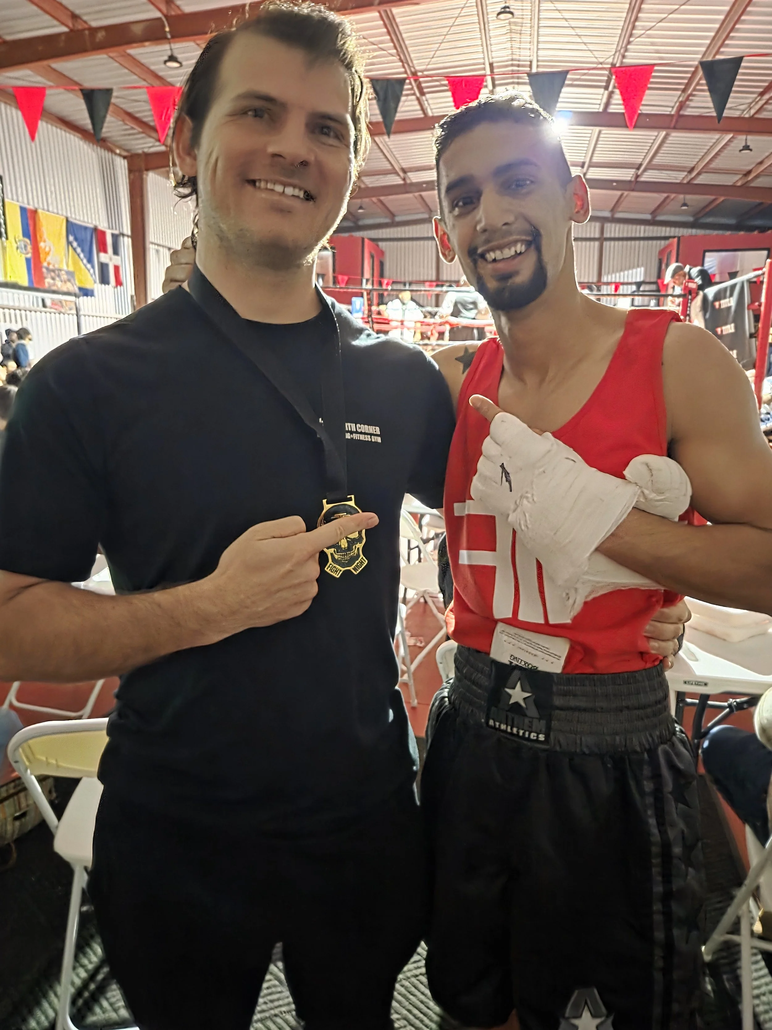 Coach Damien and boxer after his boxing match