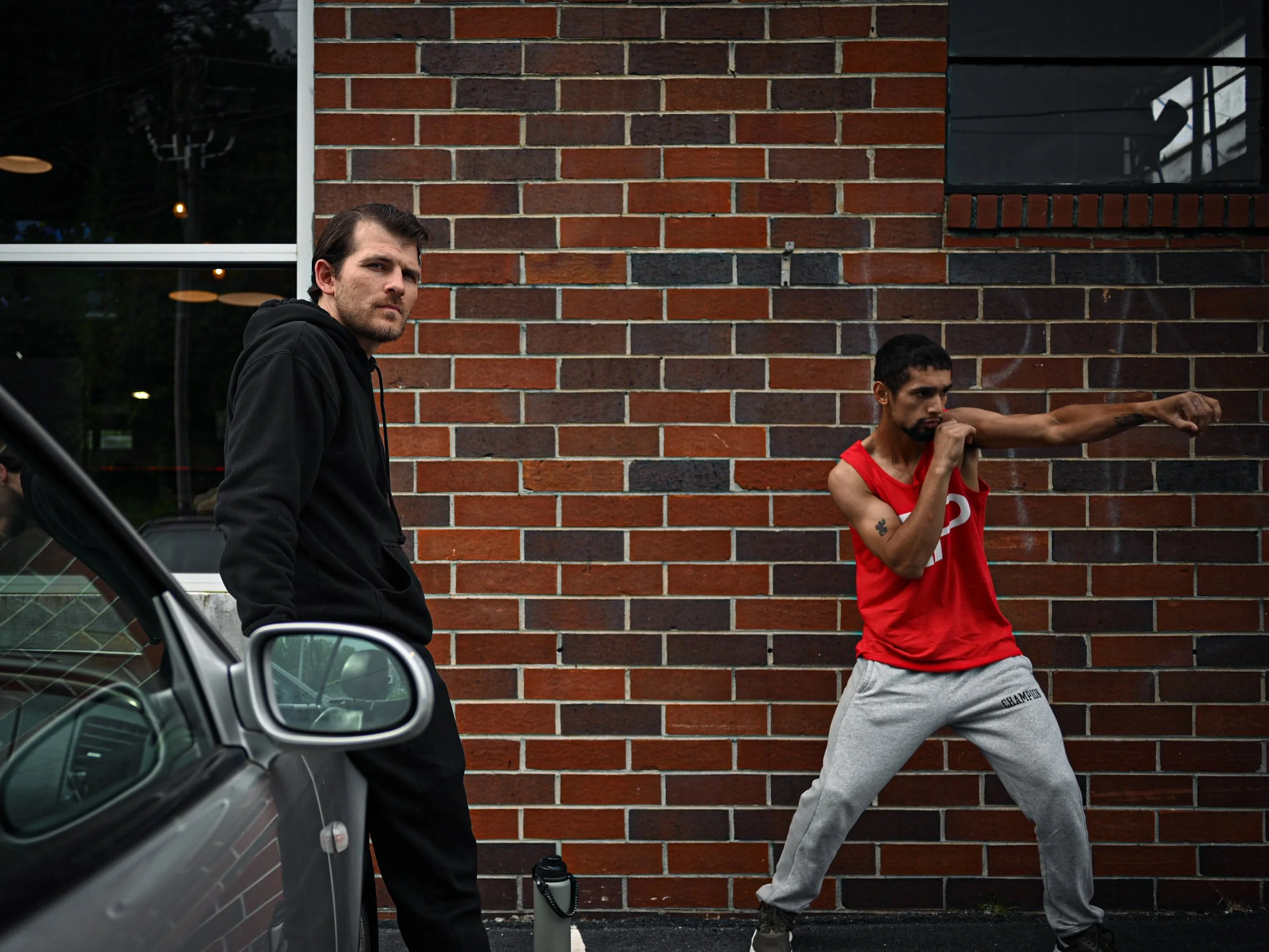 Coach Damien and his boxer, preparing for his boxing match