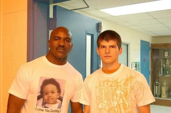Coach Damien meeting Former Heavyweight Champion Evander Holyfield at the Georgia Games