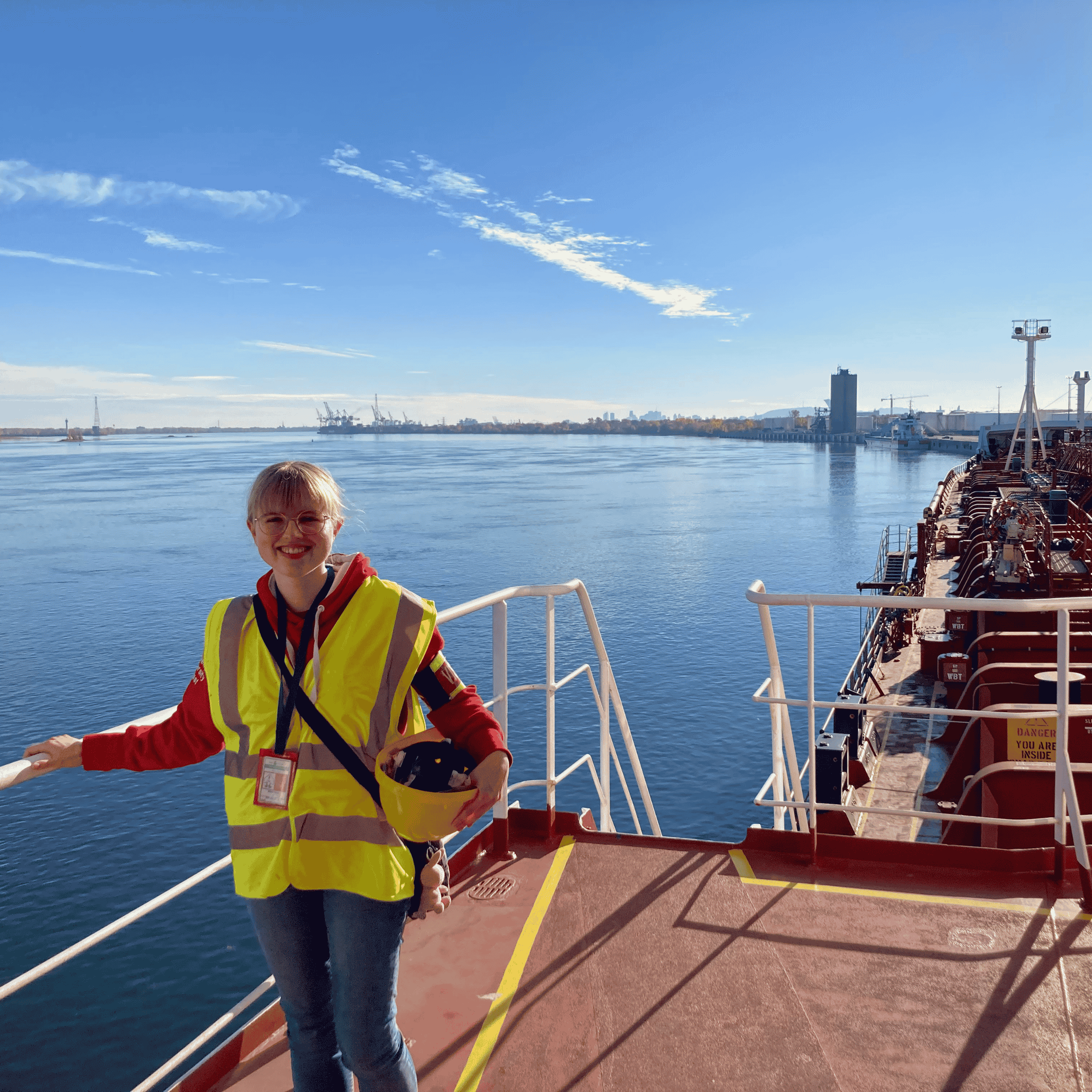 woman standing on the deck of a ship