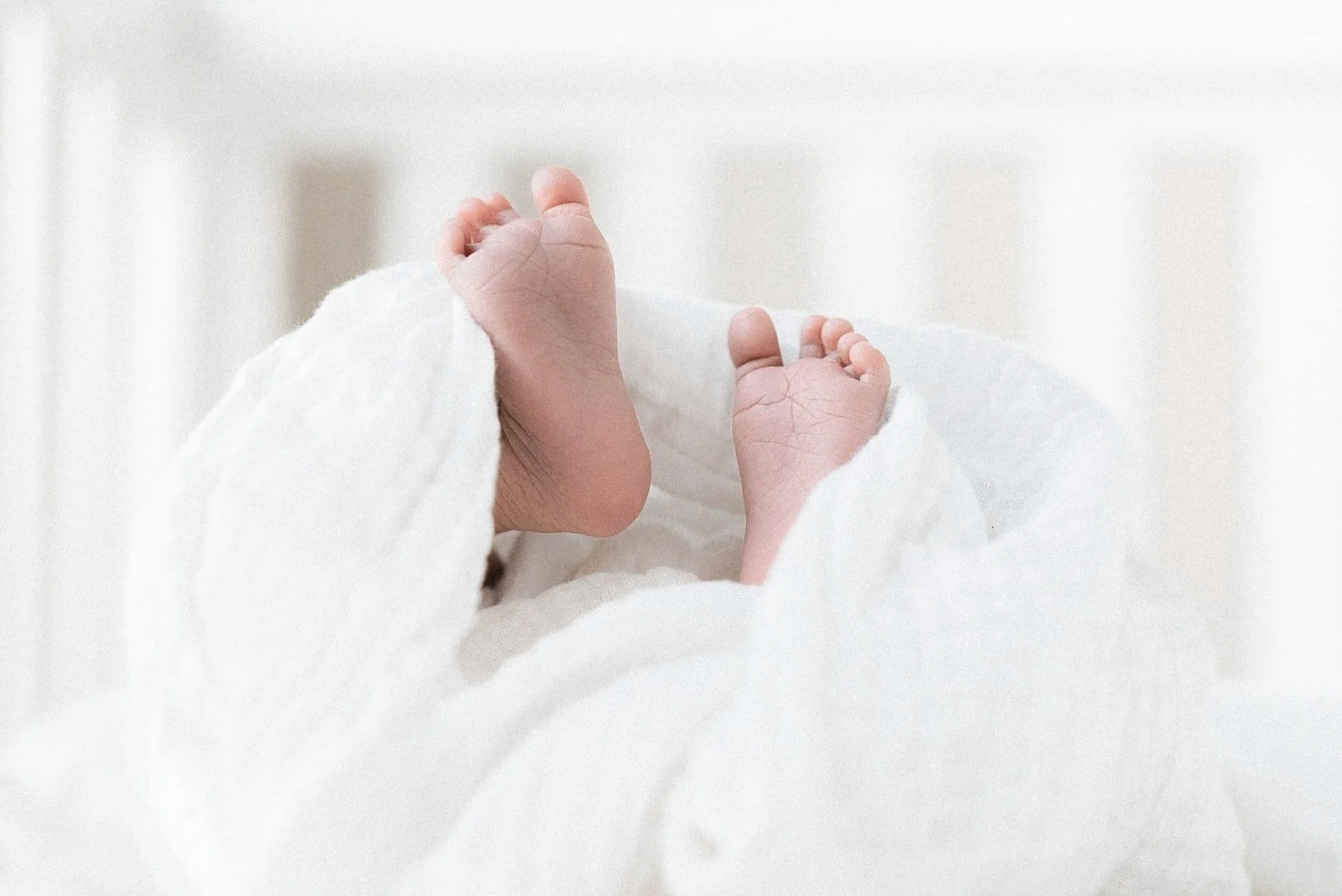 Doula and night nurse providing evidence‑based newborn support