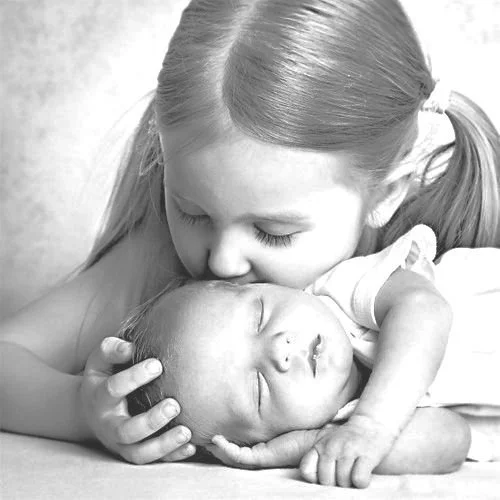 Doula and night nurse offering gentle support for sibling adjustment