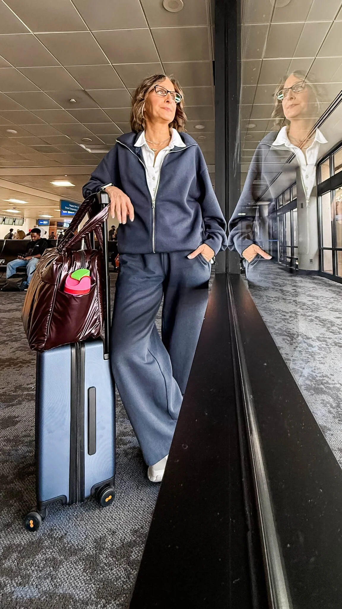 airport outfit, travel scarf, brown sneakers, carry-on suitcase