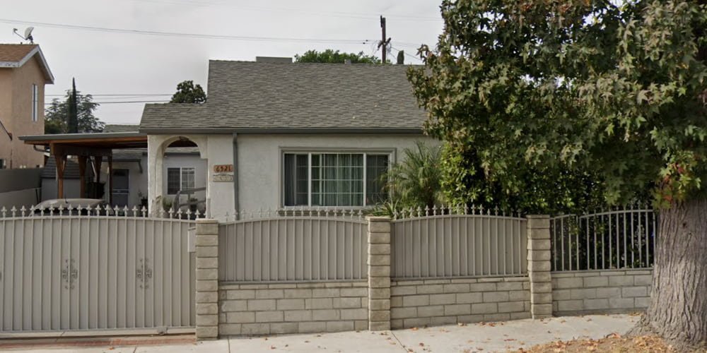 Exterior view of Bellaire Senior Care LLC, a licensed facility for home care in North Hollywood, featuring a secure gated entrance and a peaceful residential atmosphere.