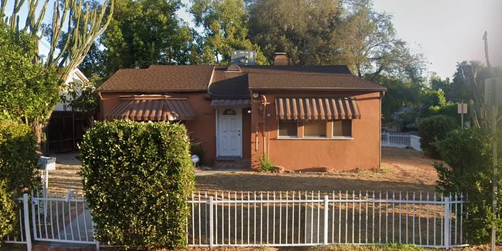 The exterior of The Comfort Place Ltd, a residential senior living home in Valley Village featuring a secure, single-story layout designed for residents receiving professional medical care.
