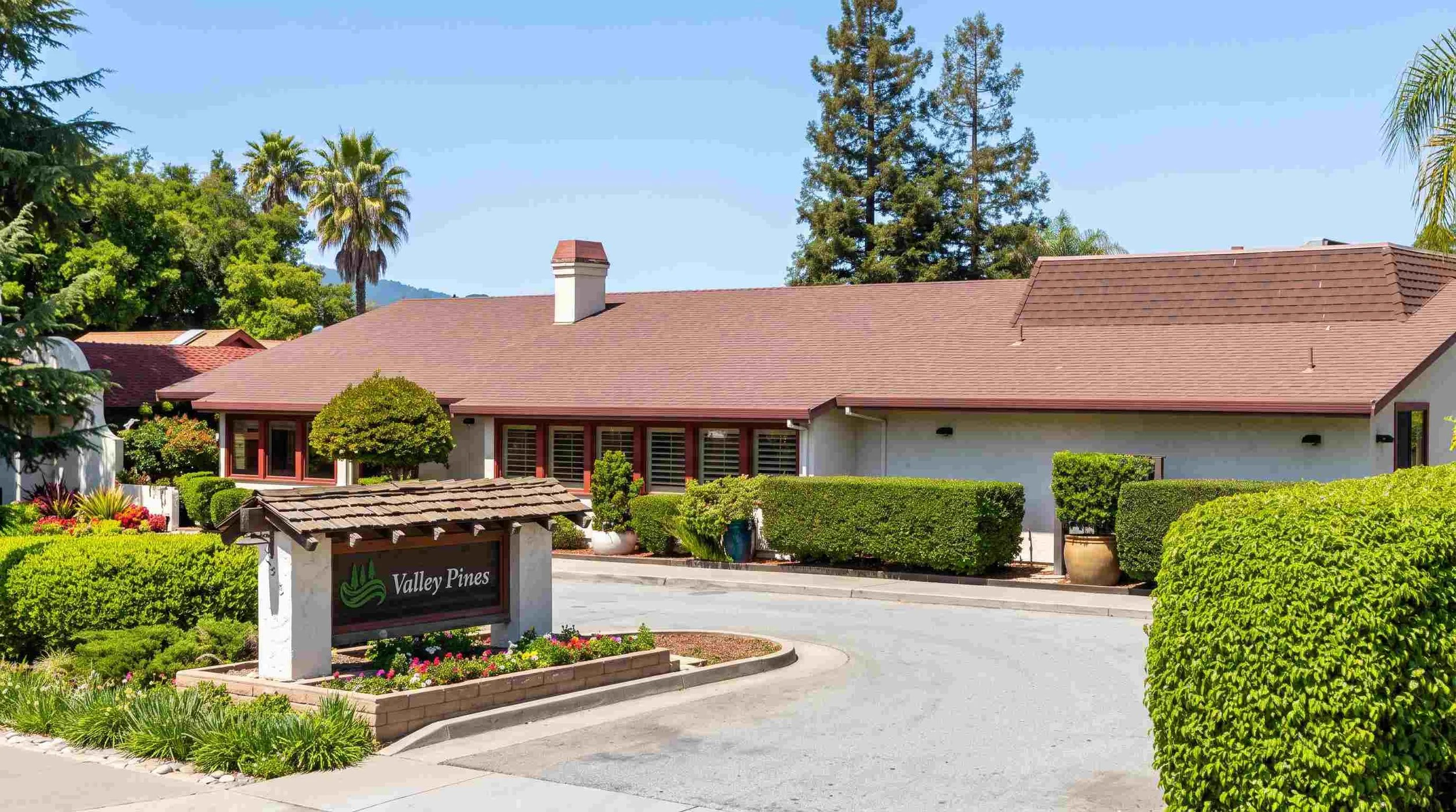 single-story family-run assisted living home on landscaped grounds on East Main Avenue in Morgan Hill, California