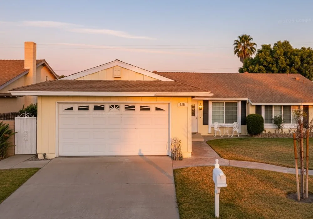 Exterior view of Angels II assisted living home in Simi Valley, California, showing a single-story residence with a front lawn, driveway, and welcoming entrance.