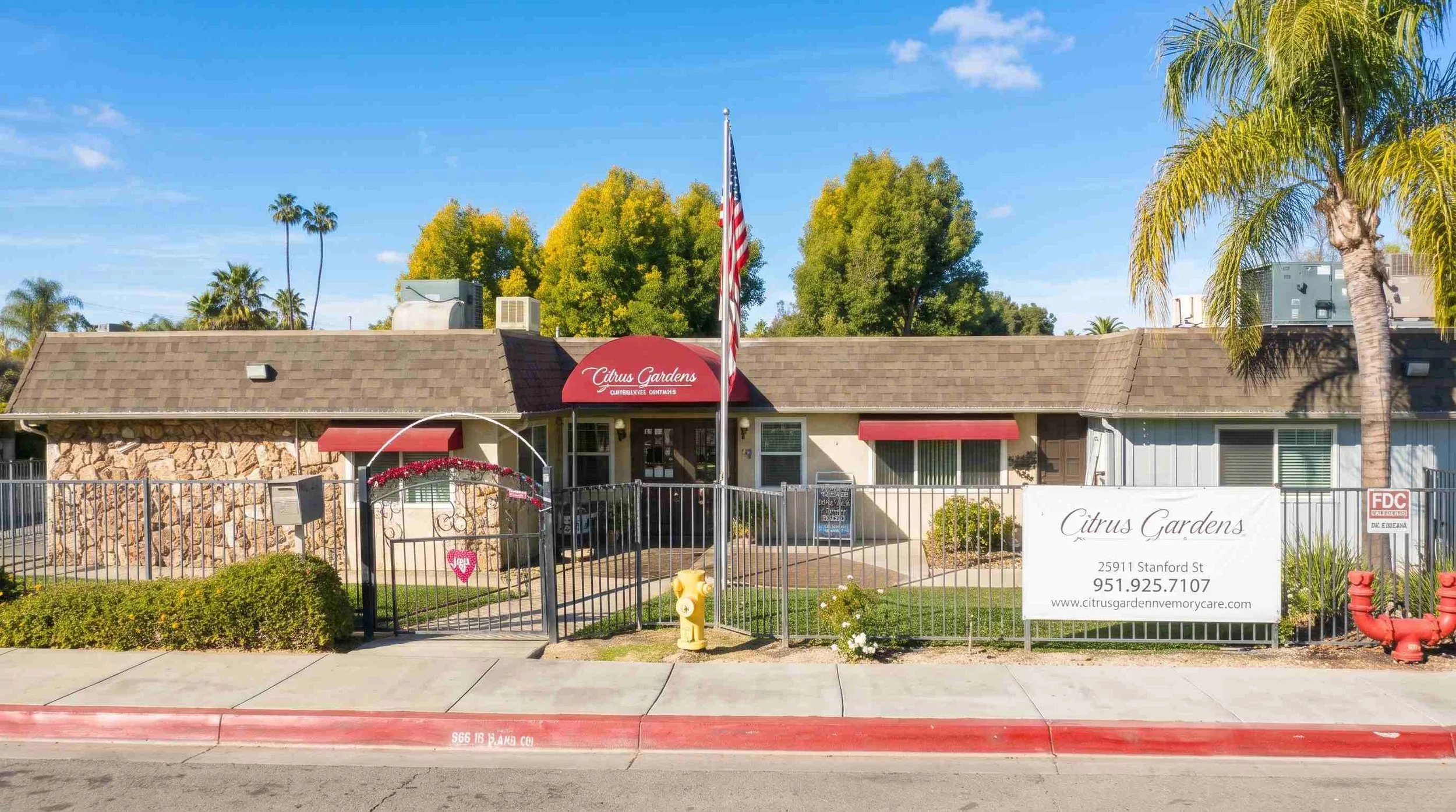 Cottage-style senior living community with a shaded central courtyard in Hemet, California