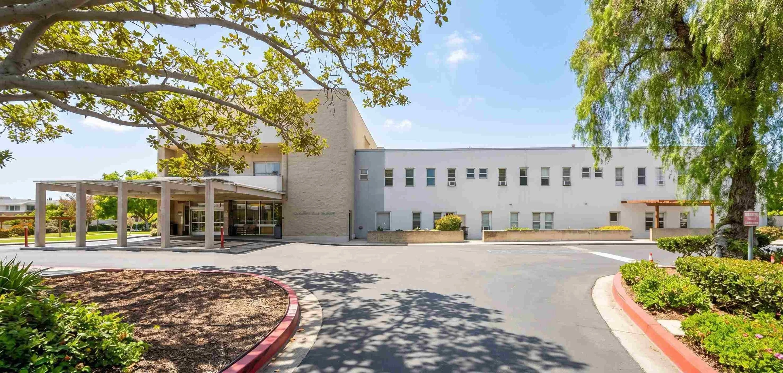 Entrance and grounds of Paradise Valley Manor assisted living in National City, California