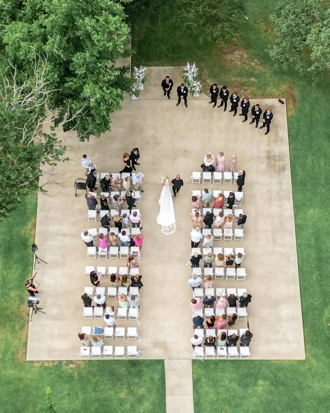 Cade + Kelli&rsquo;s wedding was the perfect balance of classic and modern. The morning started with champagne toasts and getting-ready laughs before Kelli slipped into her sleek gown. Their outdoor ceremony featured blush and green florals, a simple