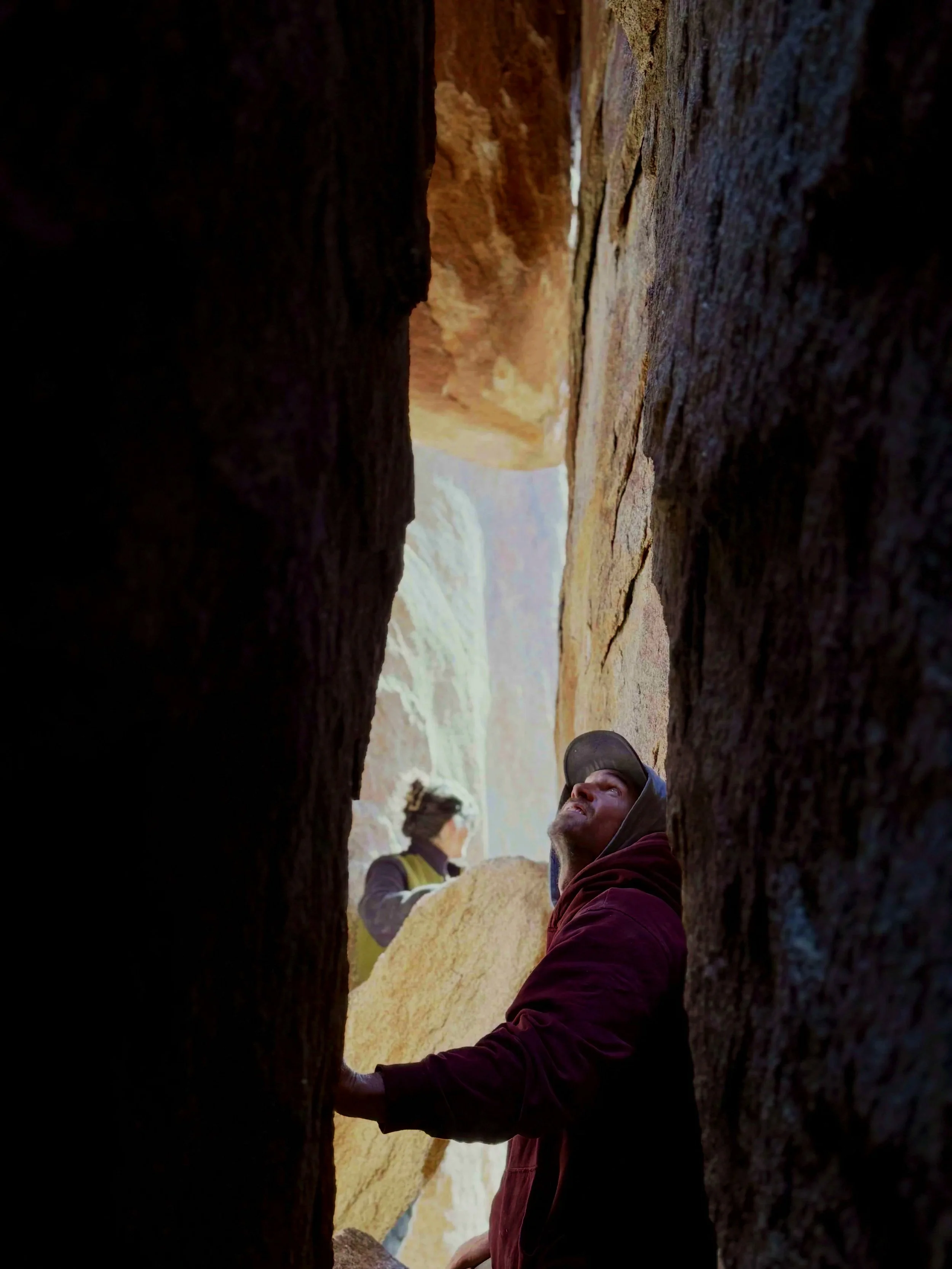 Two people exploring the Great Misdirect slot corridor on a guided adventure with Summit Climbing Guides
