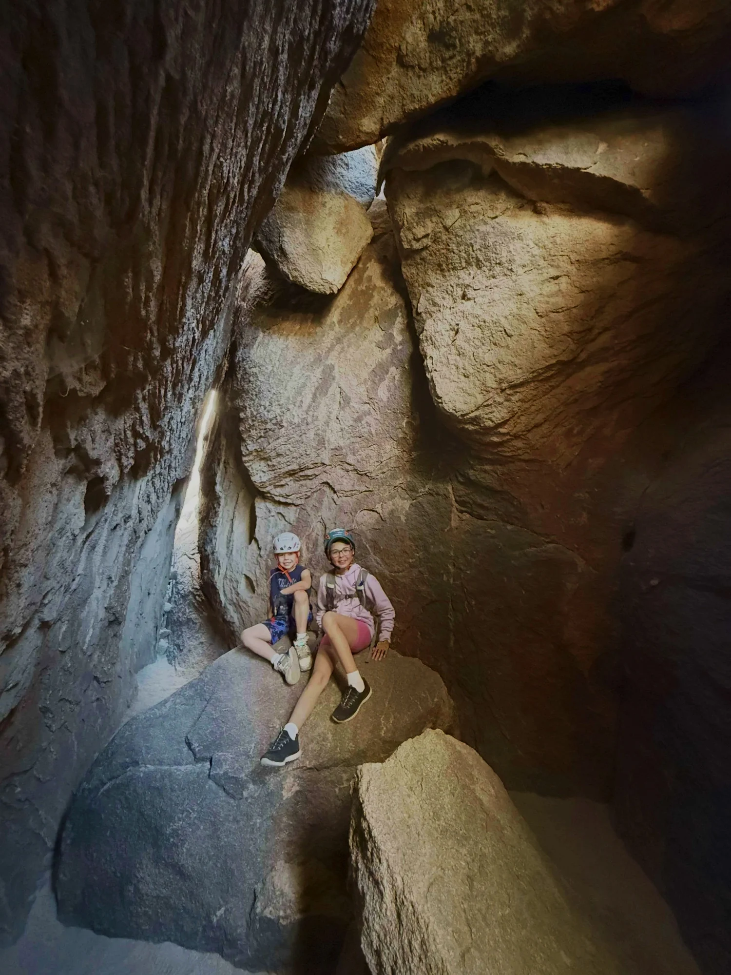 Two young adventurers in helmets ready to explore Joshua Tree