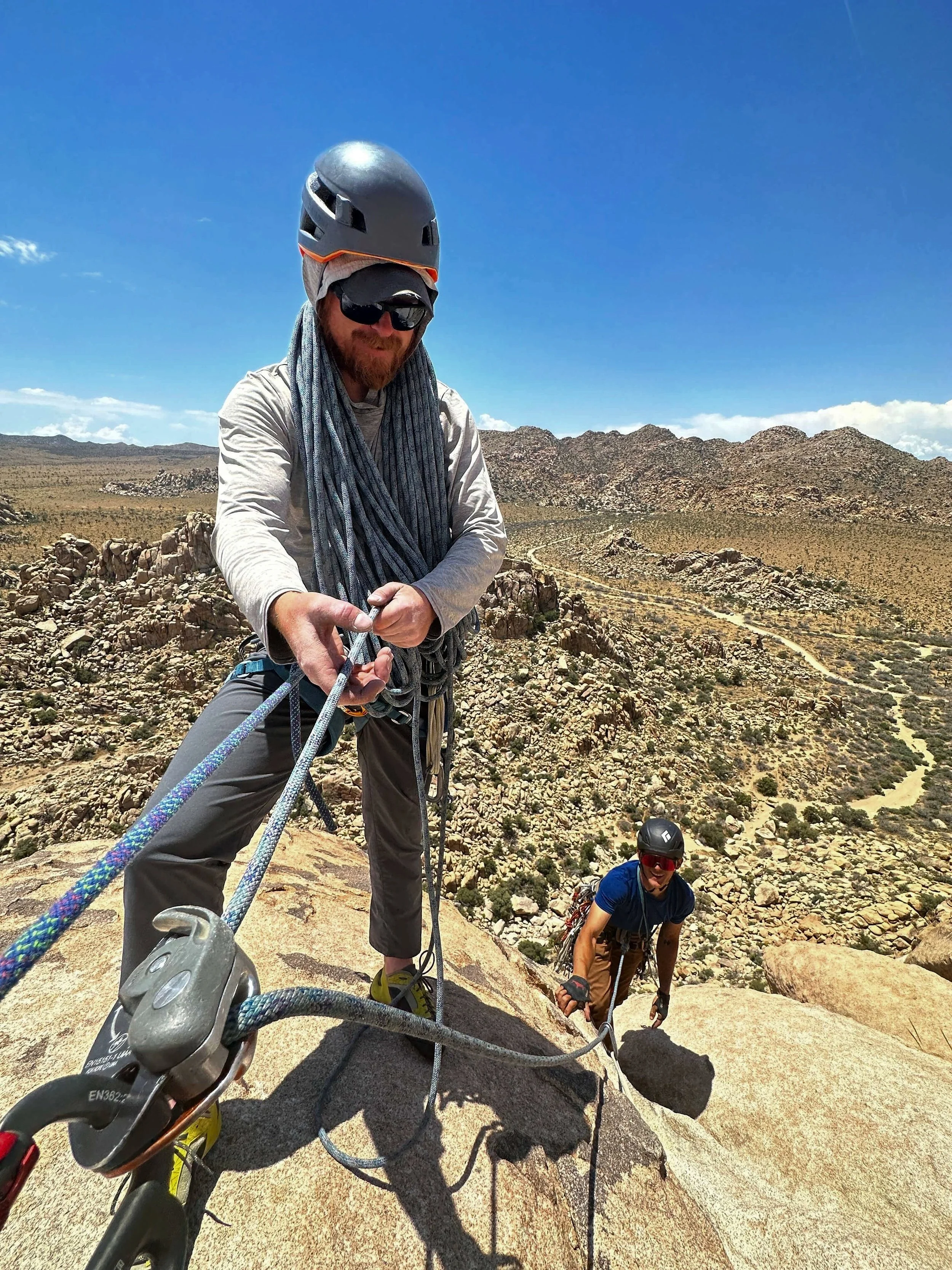Multi-pitch climbers on Lost Horse Summit in Joshua Tree — elevated views only accessible by climbing