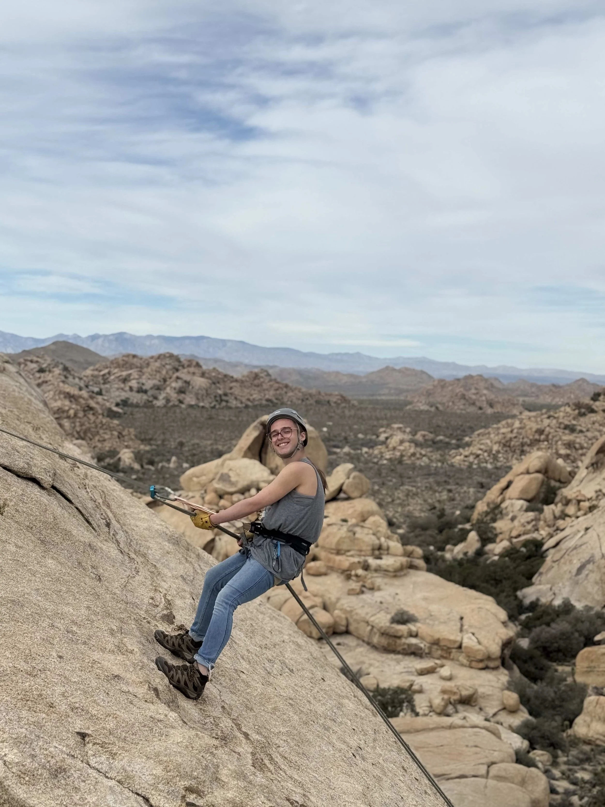Summit_Climbing_Guides_Joshua_Tree_Guides_Tours_Adventure_Backcountry_Rappelling_Person_Looking_Smiling.jpg