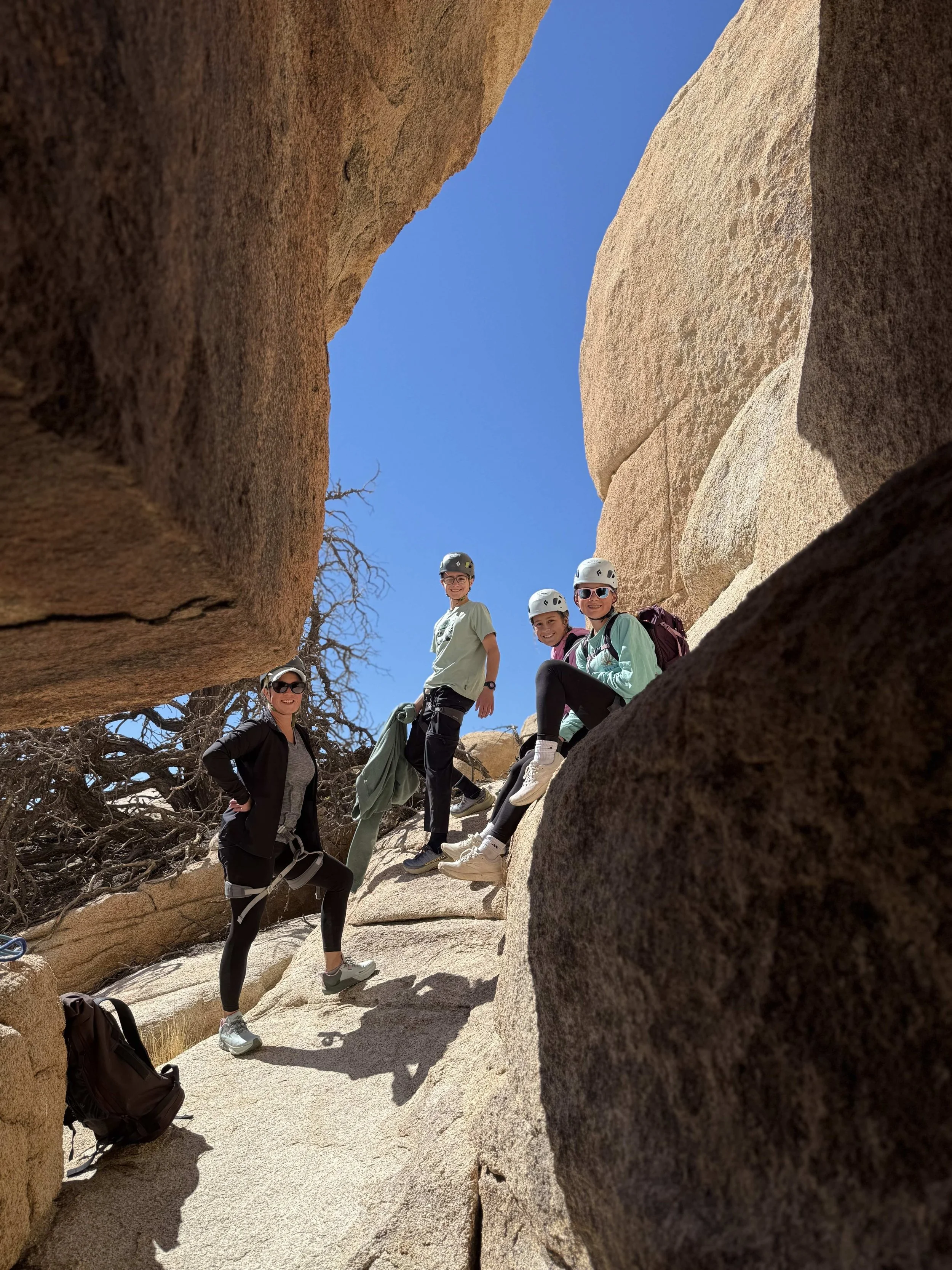 Summit_Climbing_Guides_Joshua_Tree_Guides_Adventure_Routes_Family_Looking_At_Camera_Cave.jpg