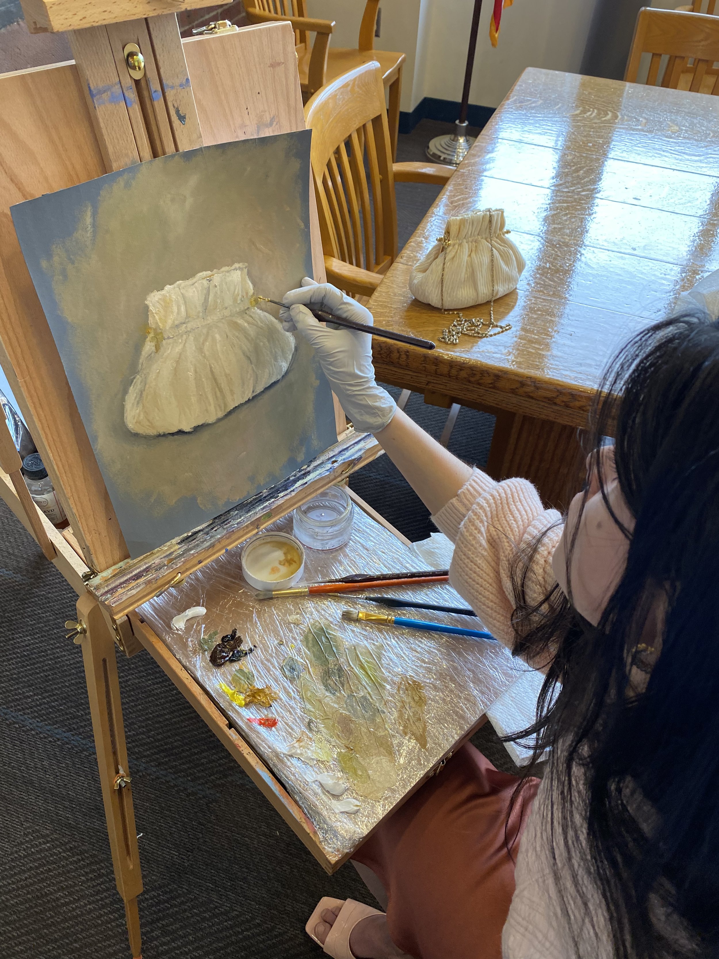 Vitoria Regia doing Live Painting of still life in her first art exhibit in Massachusetts in April 2022. Vitoria Regia Paintings