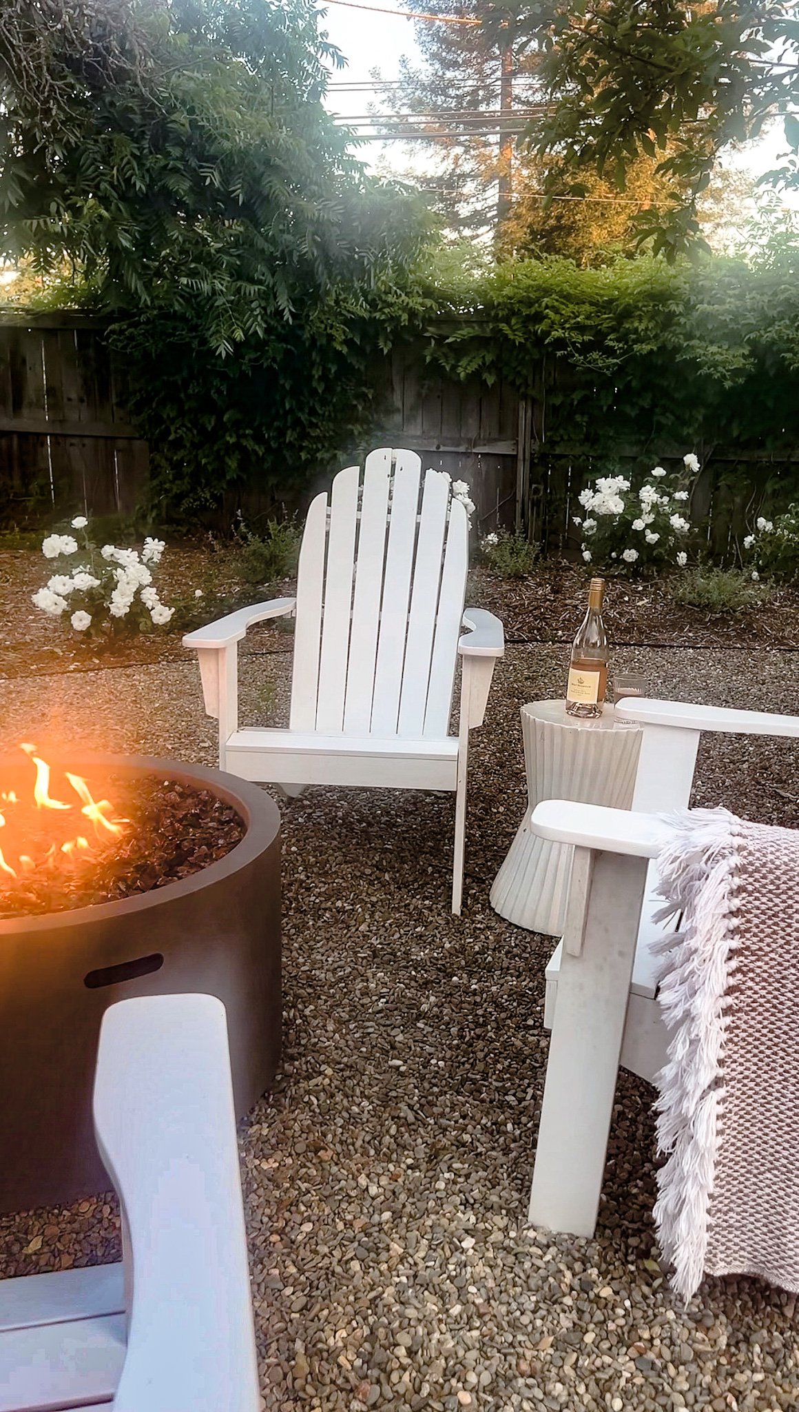 White adirondacks and firepit