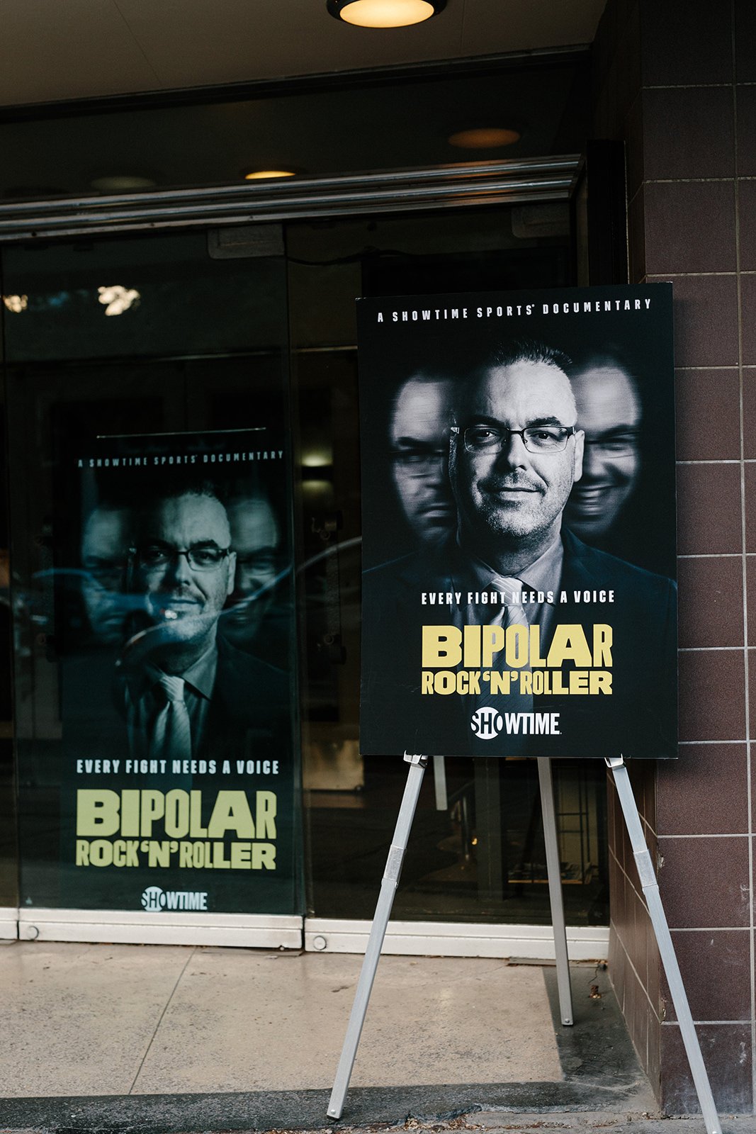 Film Screening for Bipolar Rock N Roller. Calgary Event Photography by Kapia Creative. Film posters at entrance.