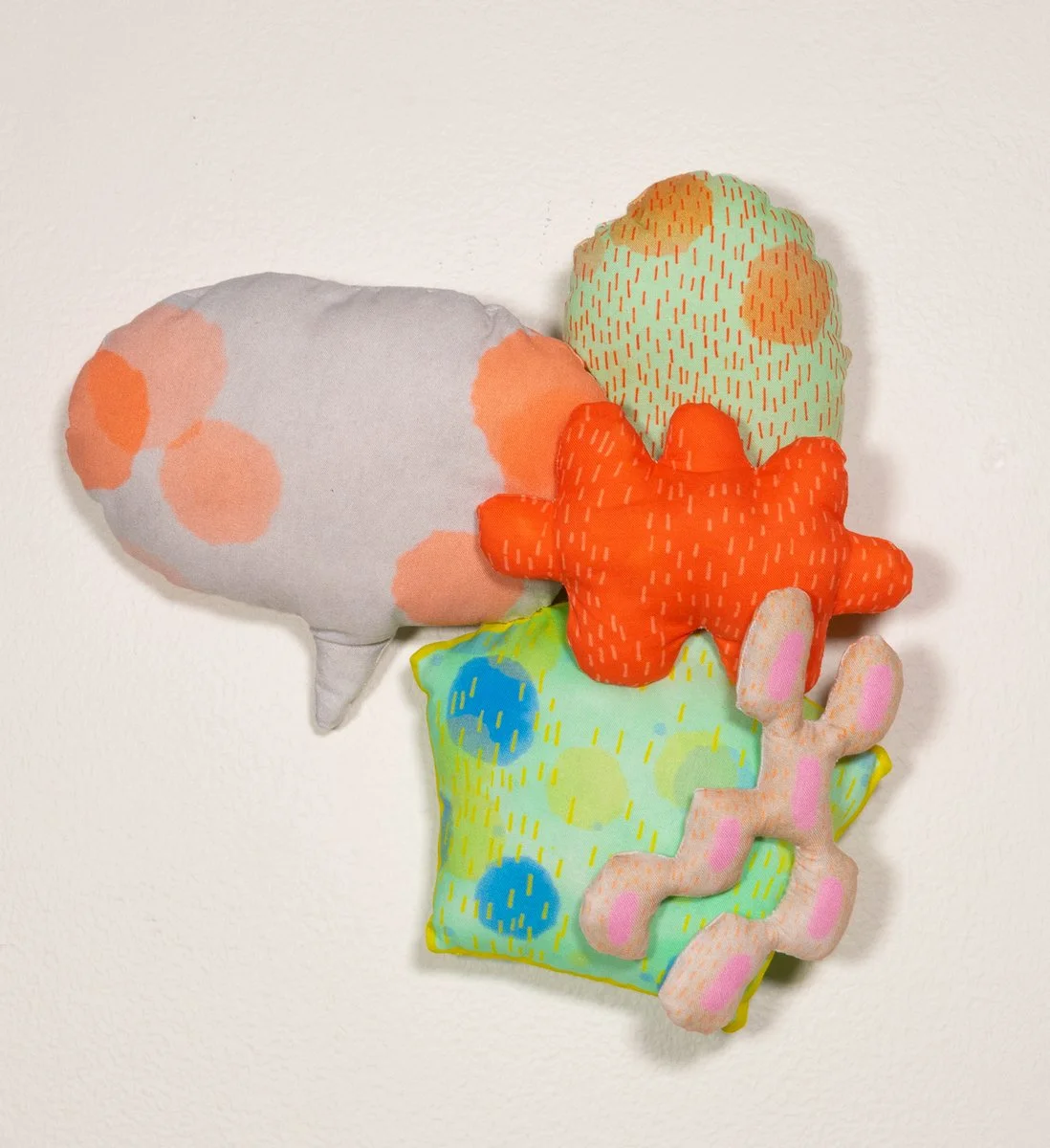 Colorful hand sewn piece with custom fabric designed from the artists prints