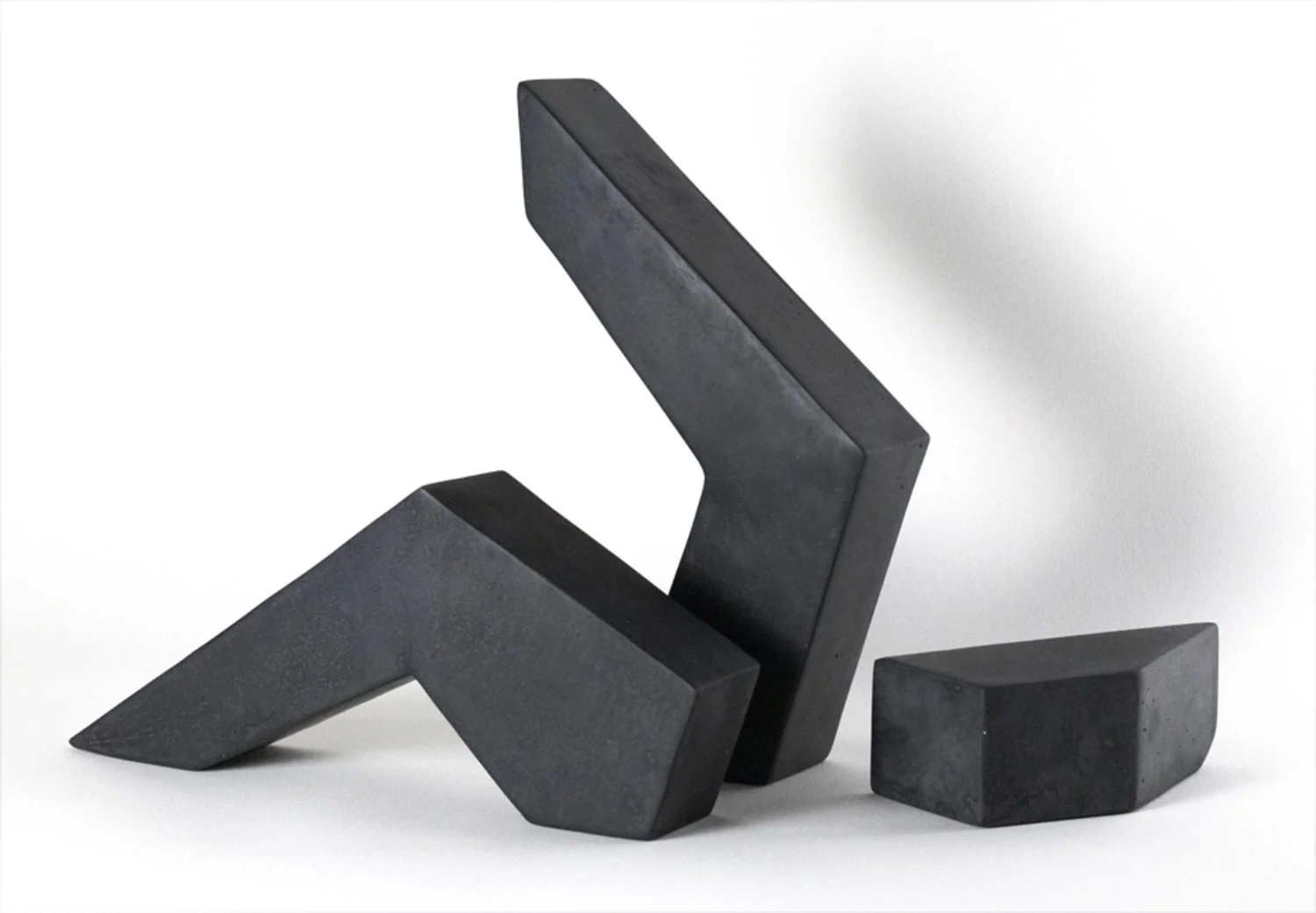 Sculpture made of three separate pieces with concrete, iron oxide, and beeswax