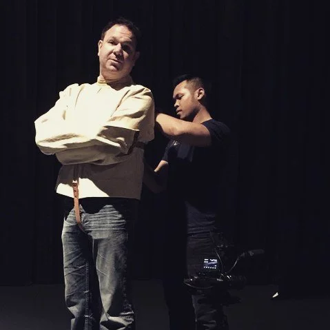Robert Strong performing a straight jacket trick at The Official Houdini Seance.