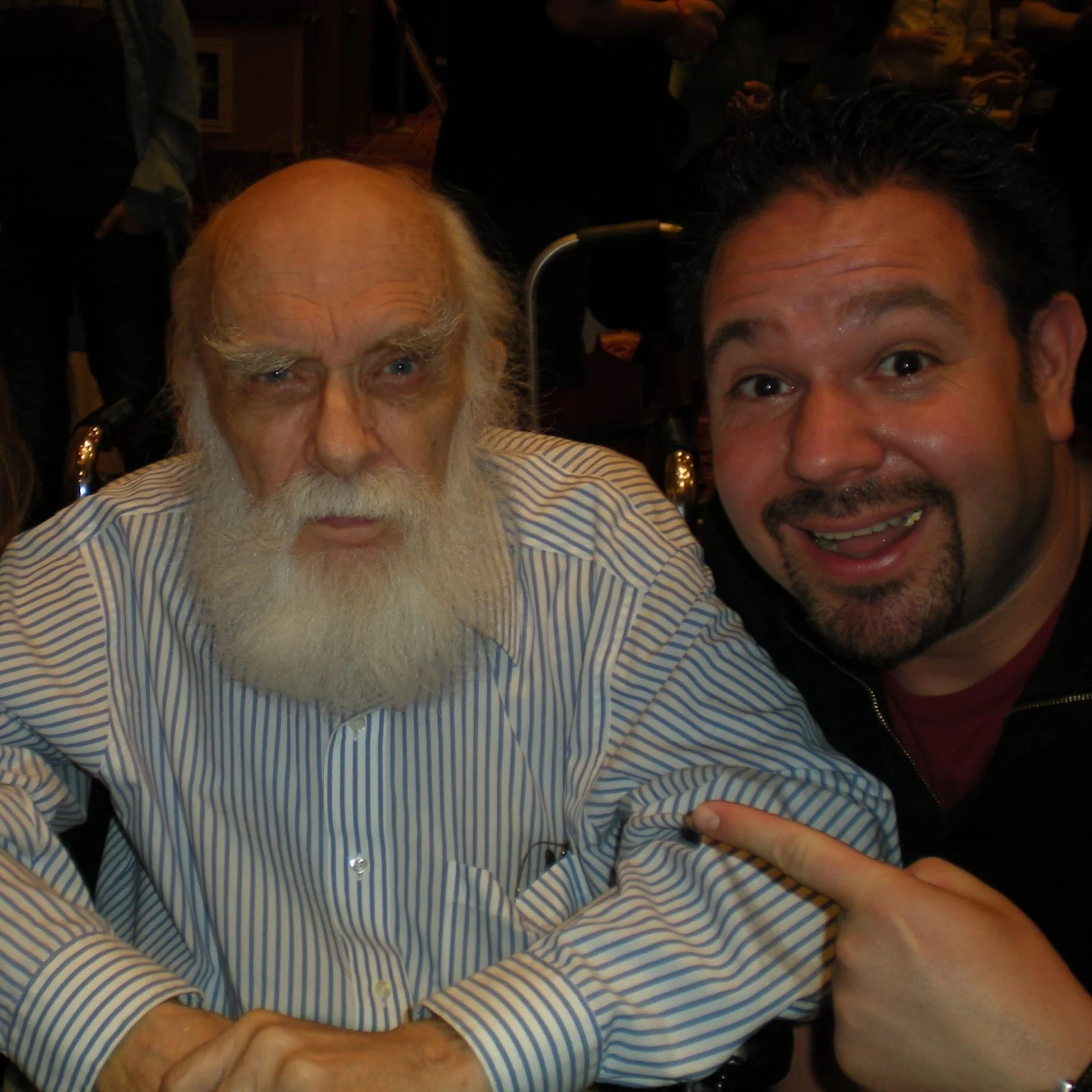 San Francisco magician Robert Strong pointing at James Randi and smiling.