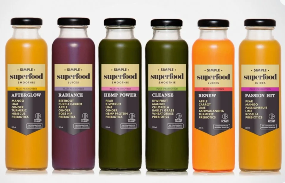 Assorted bottled cold-pressed juices and smoothies in different fruit and vegetable flavours