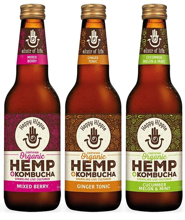 Three bottles of organic kombucha in mixed berry, ginger tonic, and cucumber melon and mint flavours