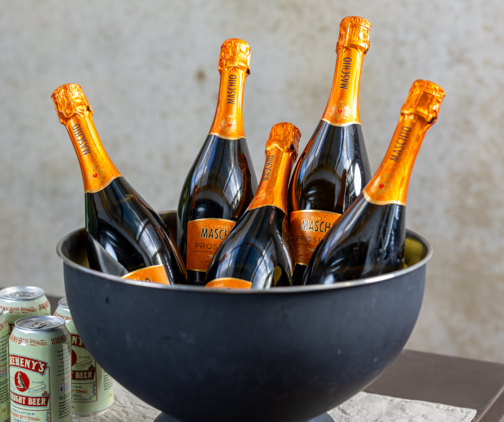 Maschio sparkling wine bottles arranged in a large drinks bowl