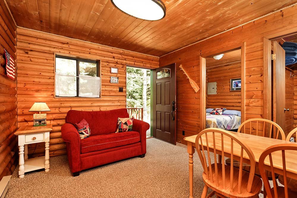 Living room and dining area in cozy camping cabin