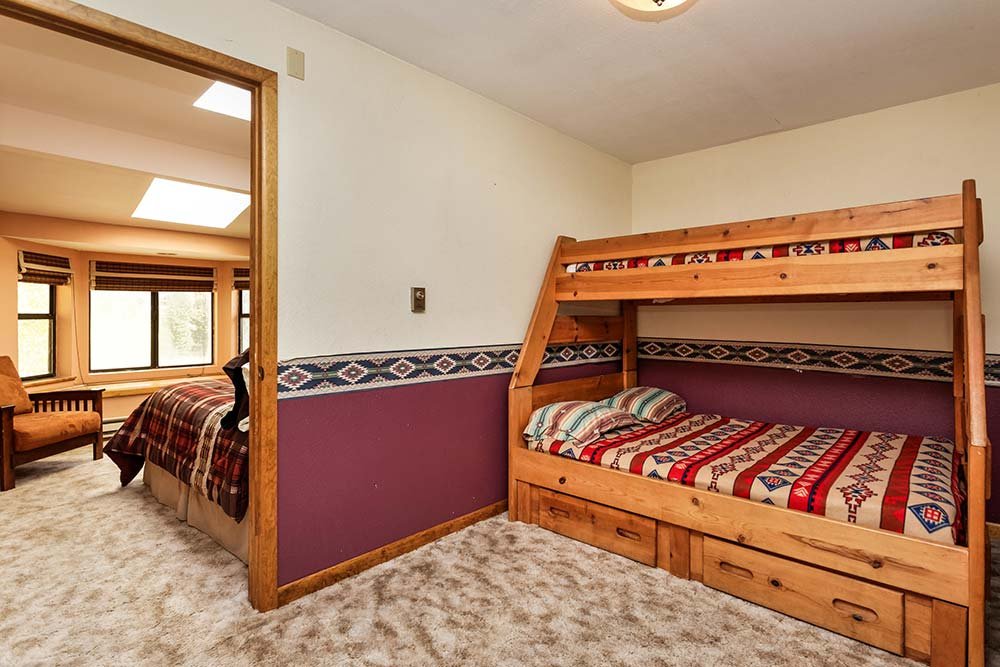 Second bedroom in upstairs barnhouse suite with twin over queen bunkbeds
