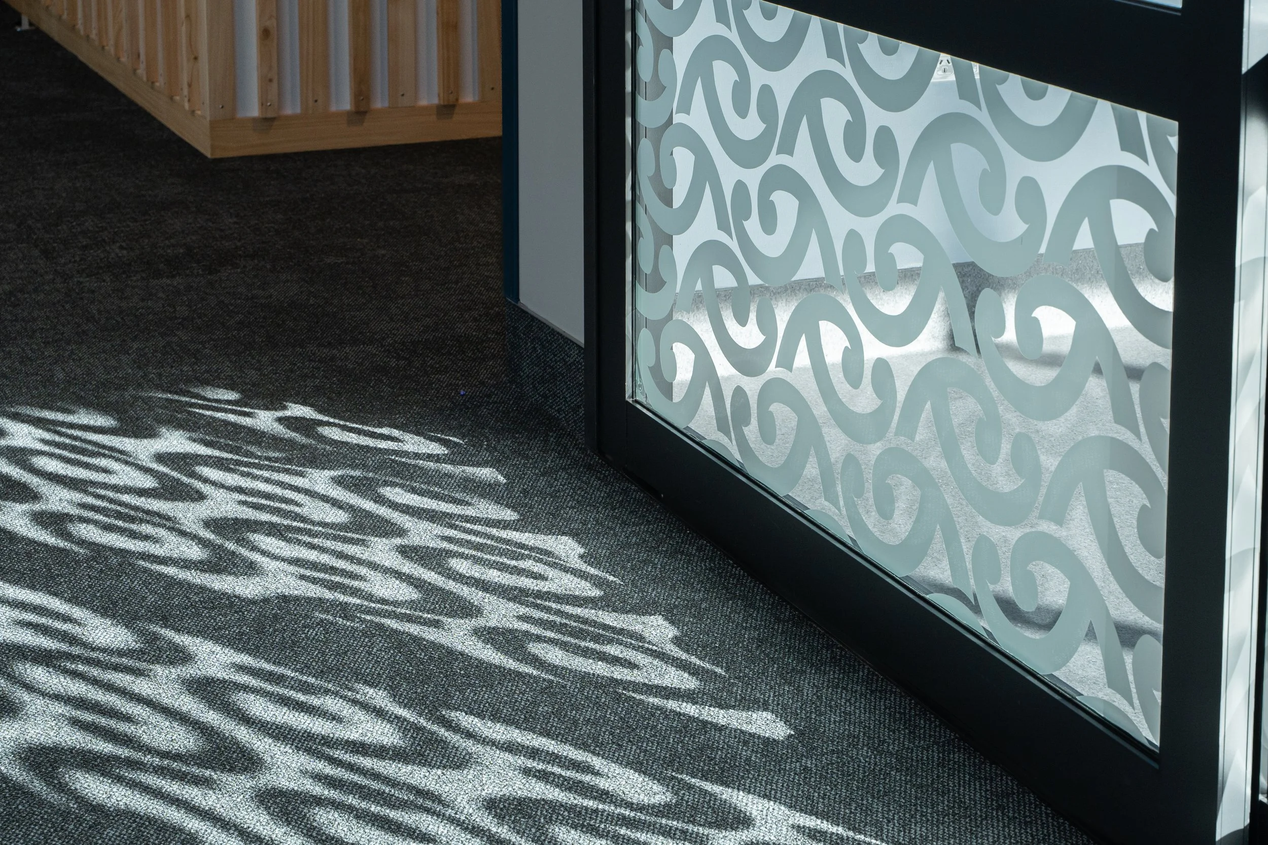 Lighting plays with the patterns through the decals on doors
