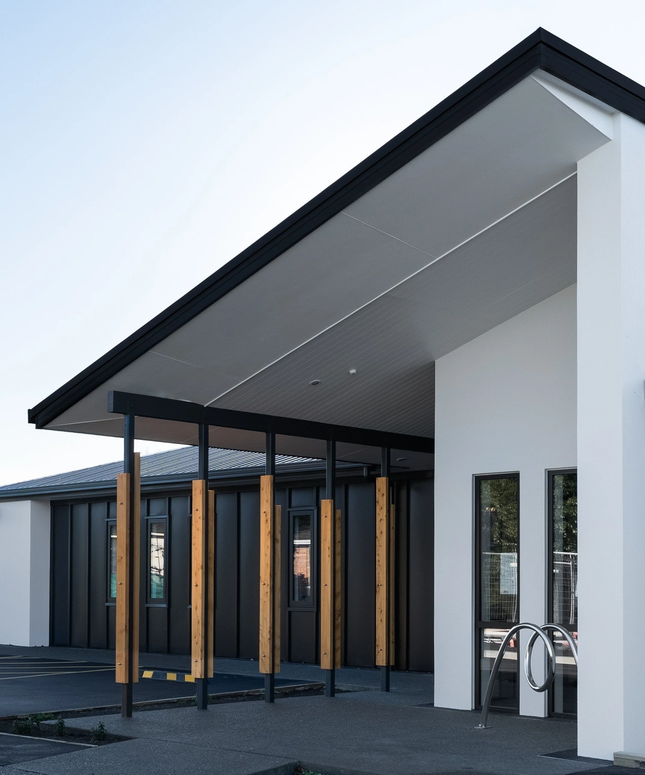 Rear Enliven building with paths covered