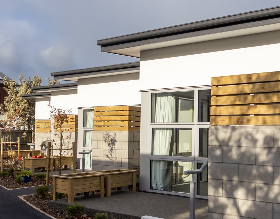 Outdoor paved areas with large windows and light-filled sheltered areas.
