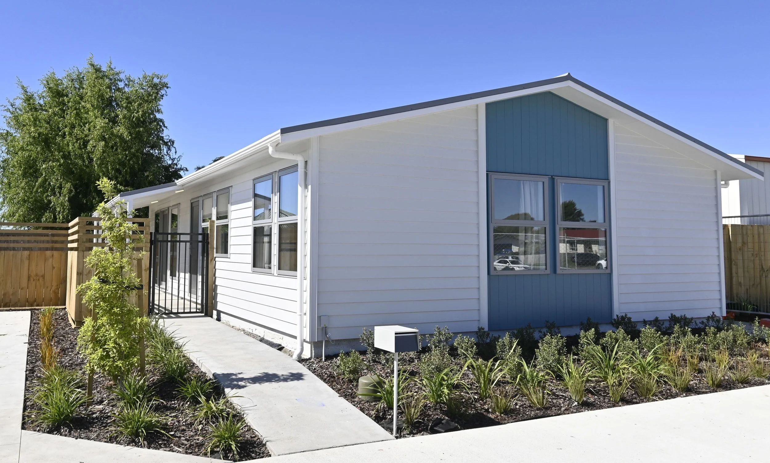 Single-level dwellings with street frontage, fencing and garden areas.