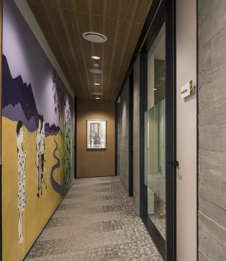 Hallway with artwork spanning the length