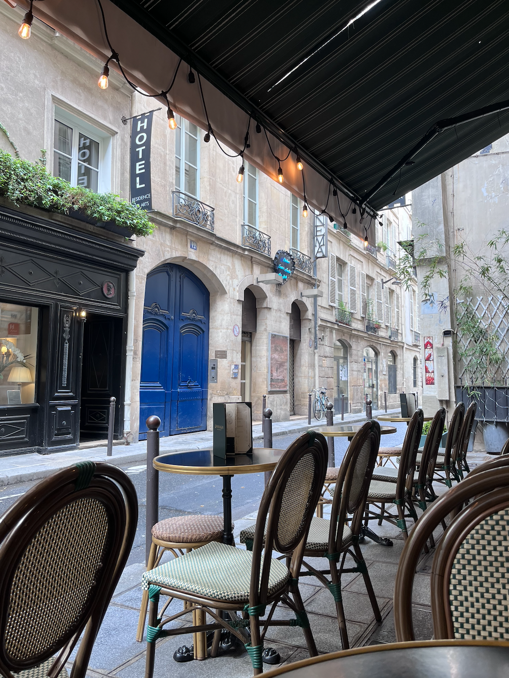 The Blue door is the Building Entry to Studio Francois, Aperitif hour across the road yes please